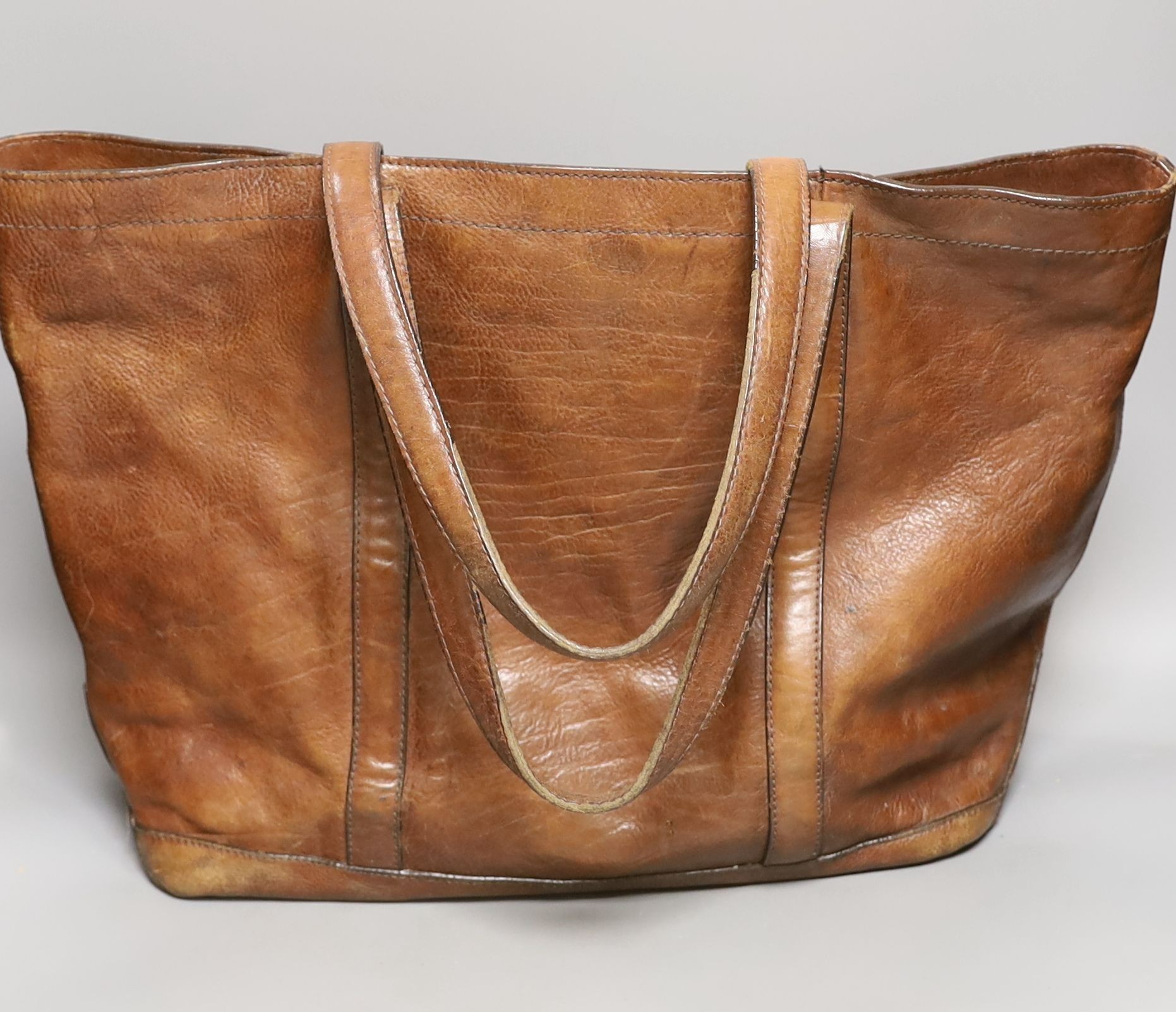 A vintage, Mulberry brown leather ‘shopper’, bag, with shoulder straps, 35 cms high x 52 cms wide.